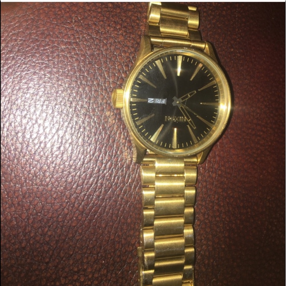 gold nixon watch